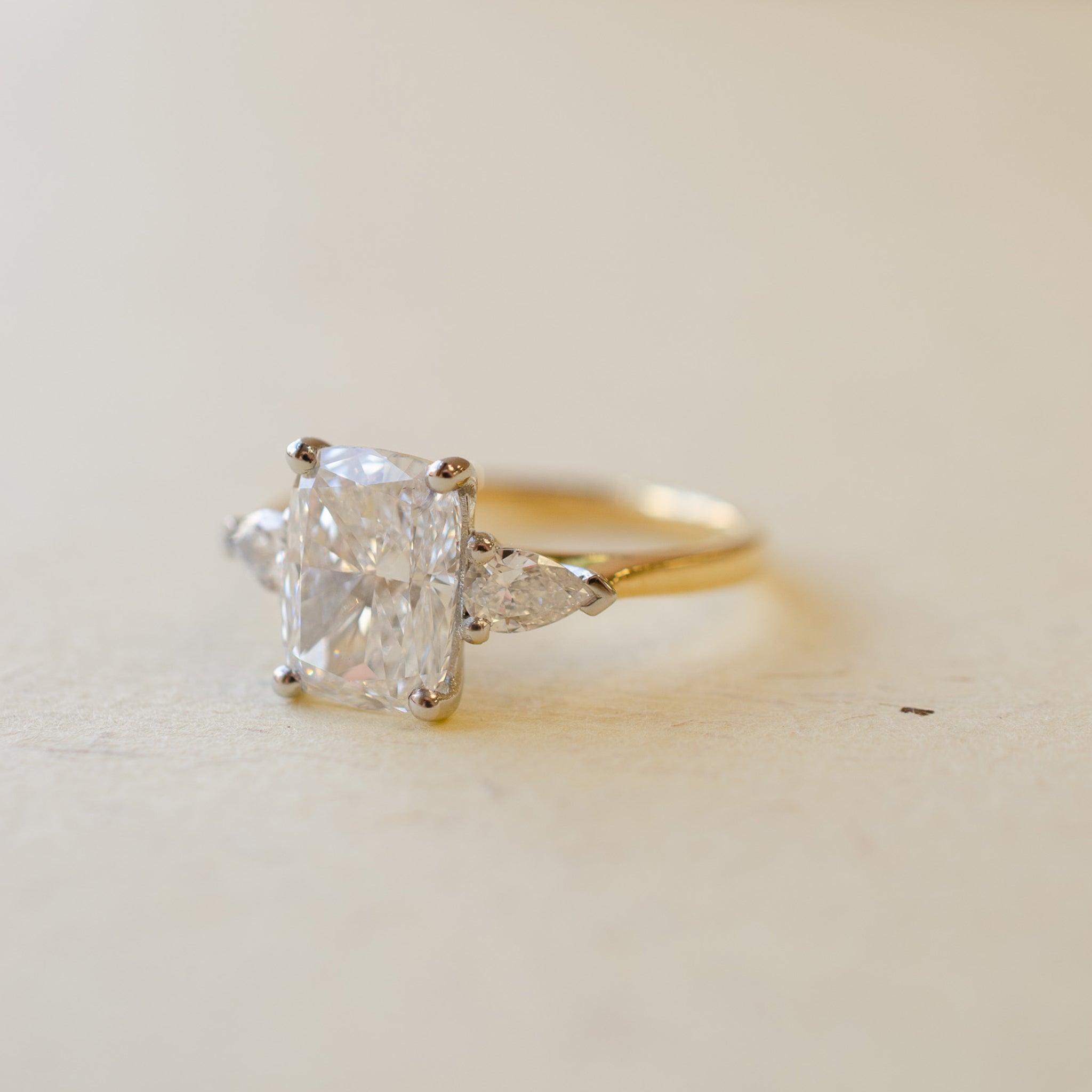 Cushion Cut & Pear Shape Diamond Trilogy Engagement Ring