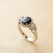 Blue Oval Sapphire & Diamond Halo Trilogy Engagement Ring