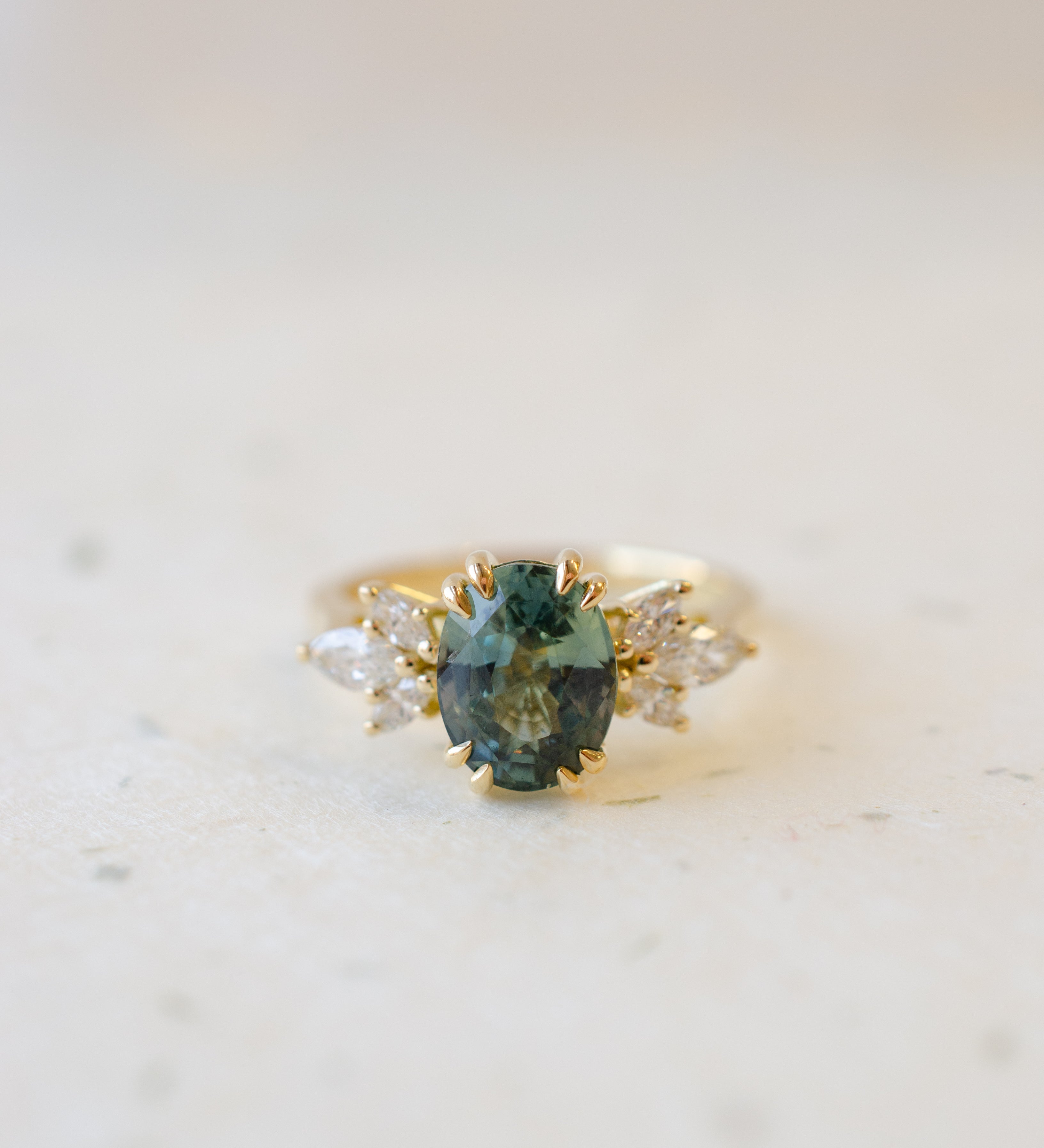 Oval Teal Sapphire with Double Talon Claws & Marquise Diamond Shoulders