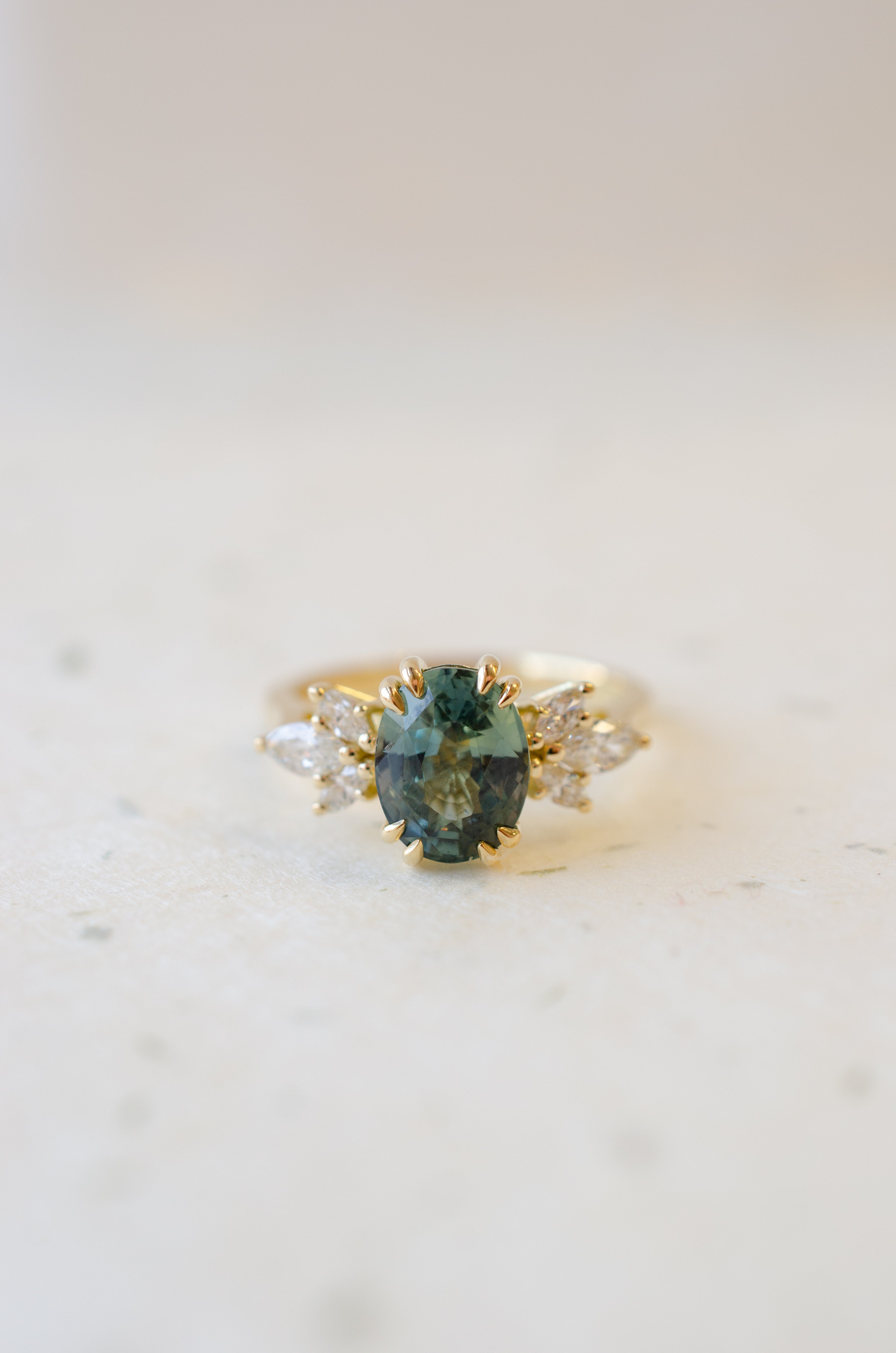 Oval Teal Sapphire with Double Talon Claws & Marquise Diamond Shoulders