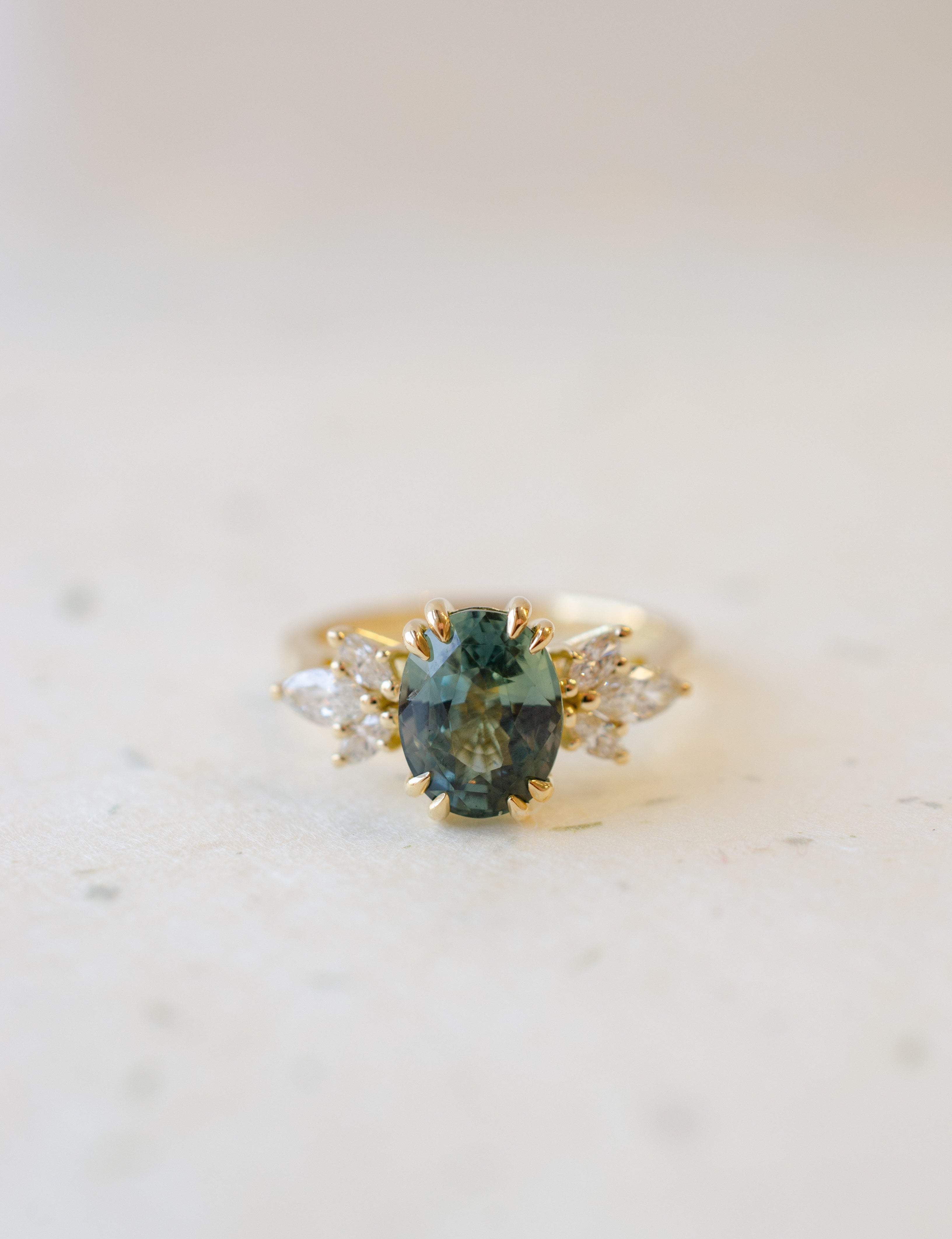 Oval Teal Sapphire with Double Talon Claws & Marquise Diamond Shoulders