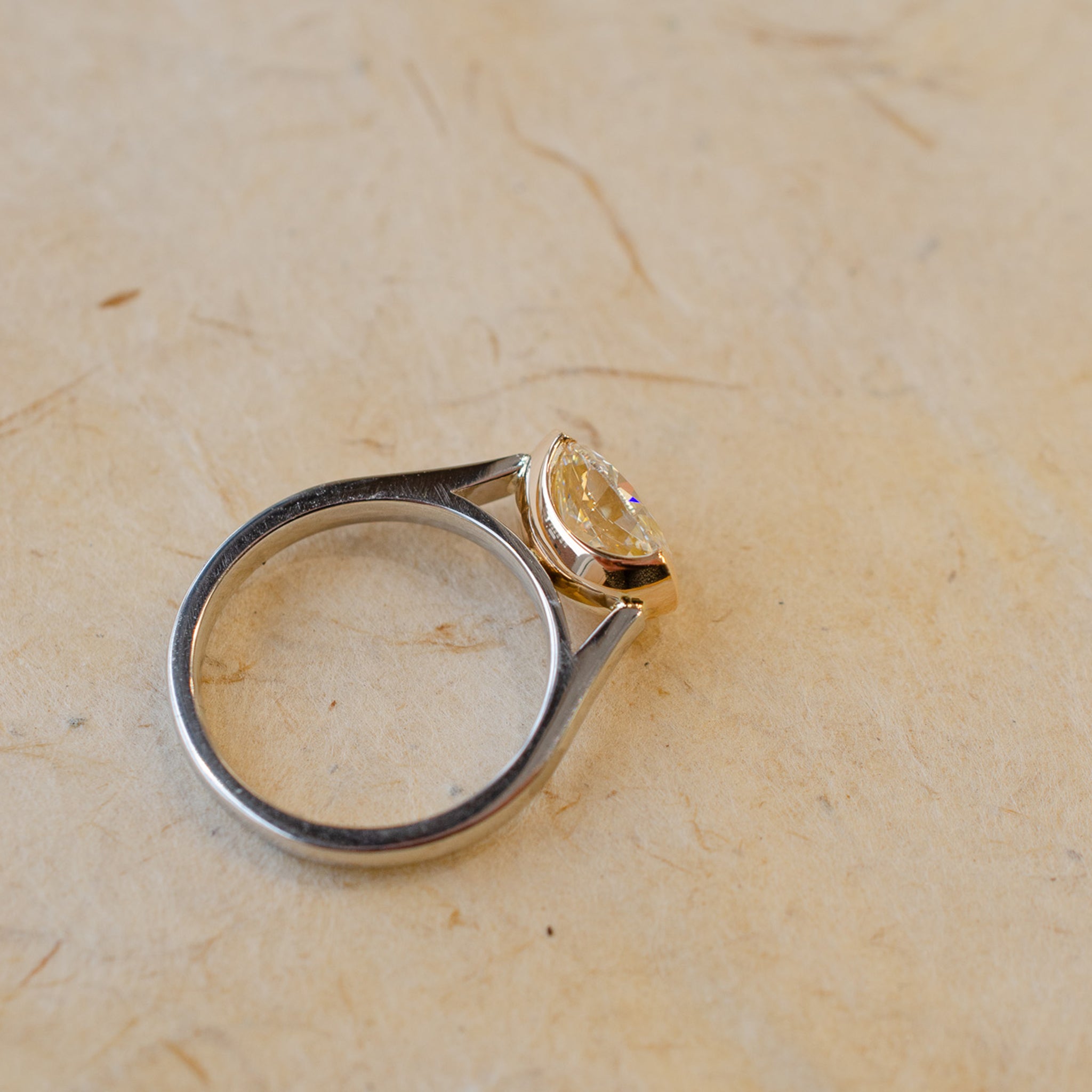 0000s_0006_DemiBezelSetOvalDiamondInRoseGold_Platinum1.jpg