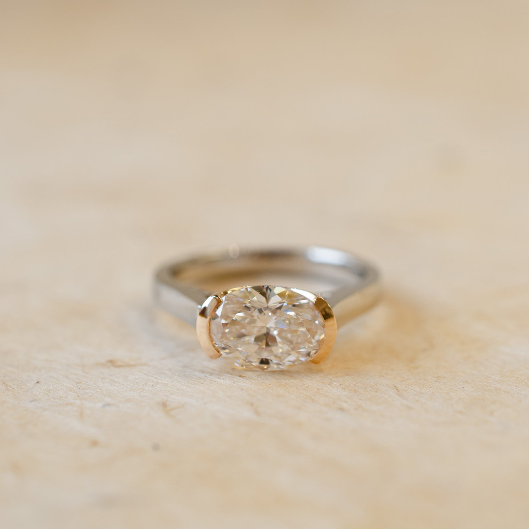 0000s_0007_DemiBezelSetOvalDiamondInRoseGold_Platinum.jpg