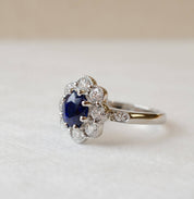 blue sapphire and diamond platinum cluster ring with milgrain