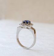 platinum blue sapphire cluster ring with diamonds