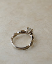 twist engagement ring with diamond centre stone