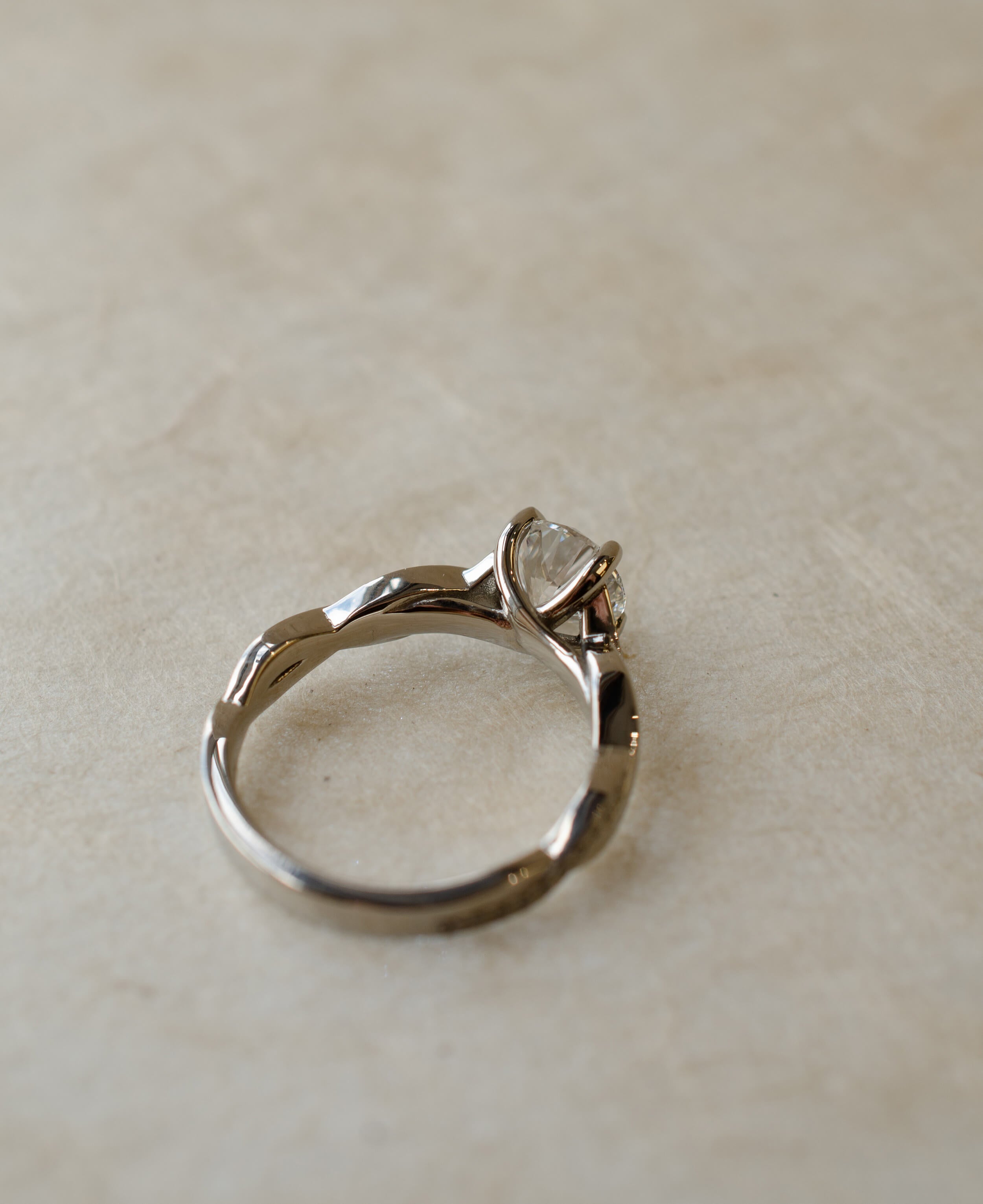 twist engagement ring with diamond centre stone