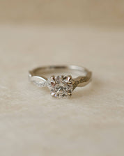 round brilliant diamond engagement ring with twist shank