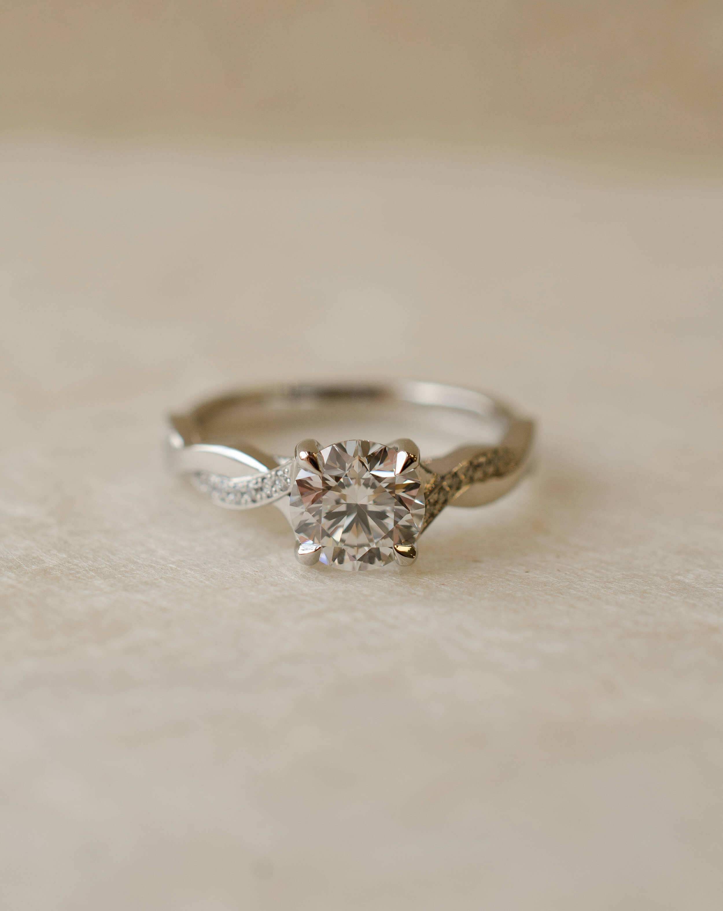 round brilliant diamond engagement ring with twist shank