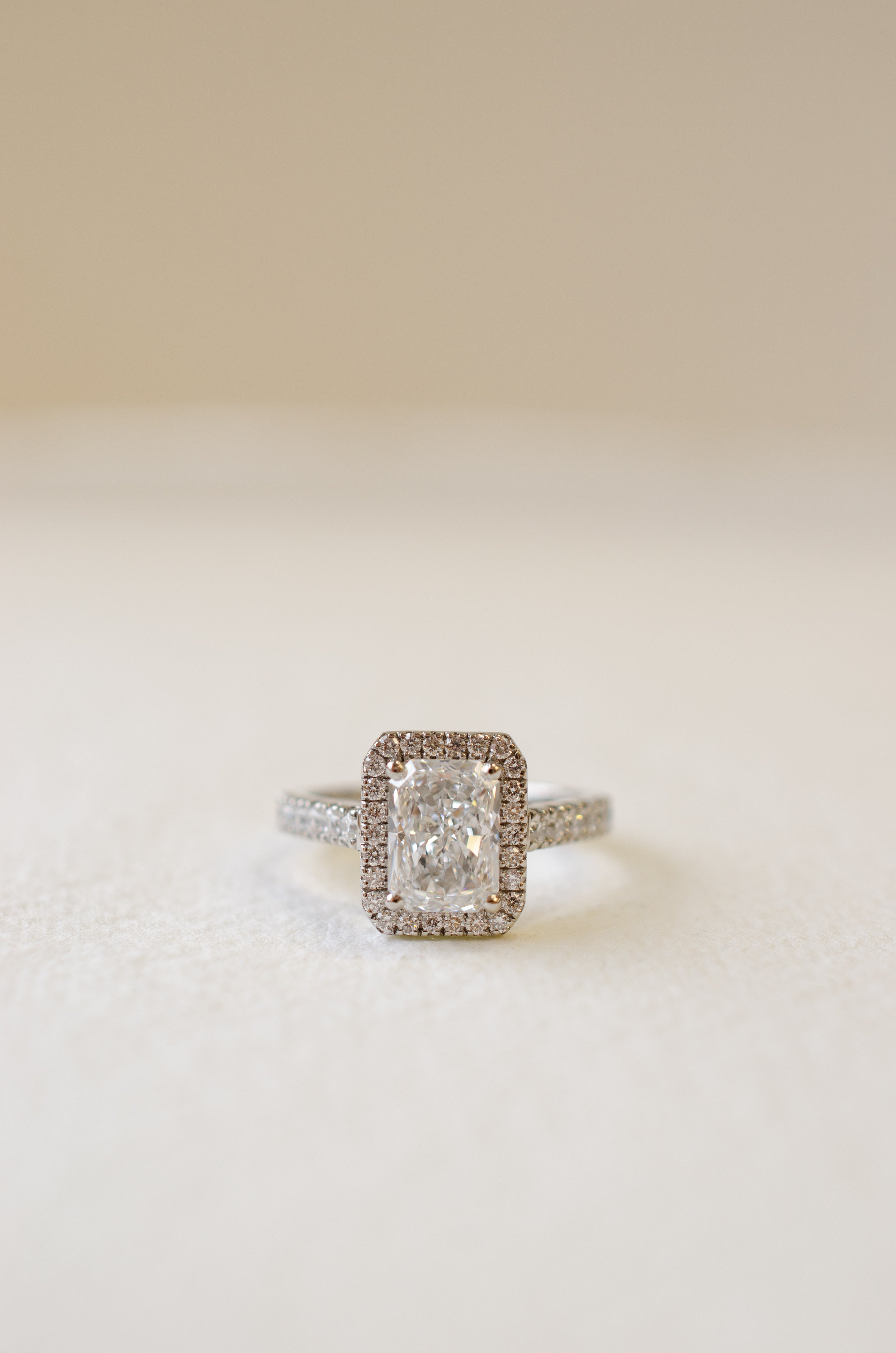 Lab grown diamond engagement ring emerald cut halo