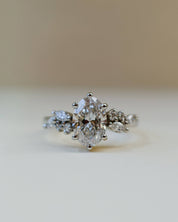 oval diamond scatter shoulder ring in platinum