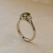 platinum trilogy ring with green lab-grown diamond