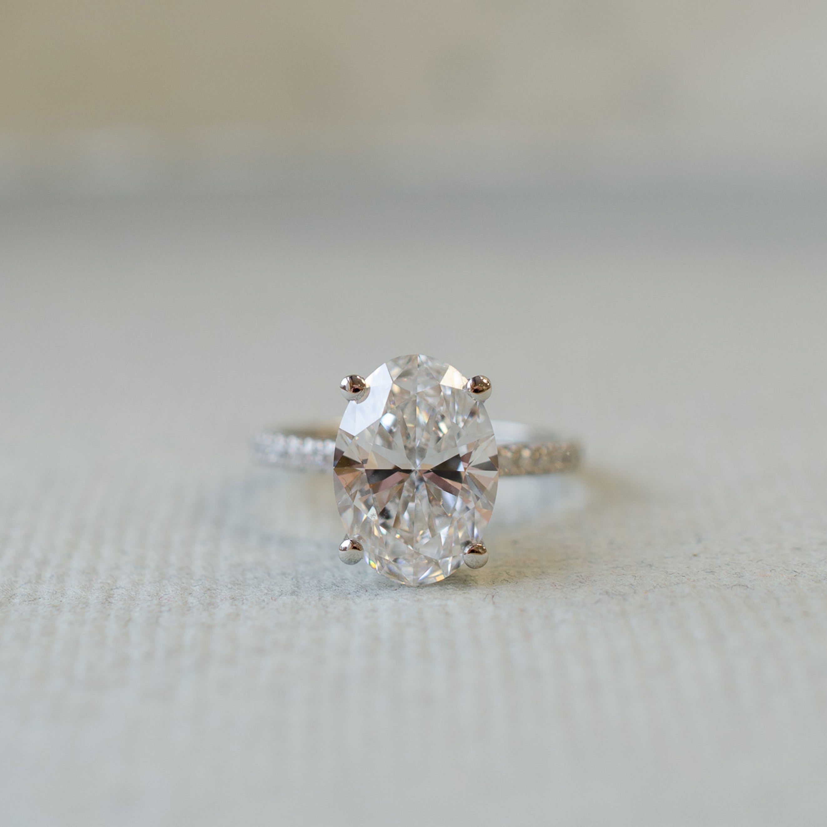 OvalDiamondSolitaireRingWithDiamondCollarHalo2.jpg