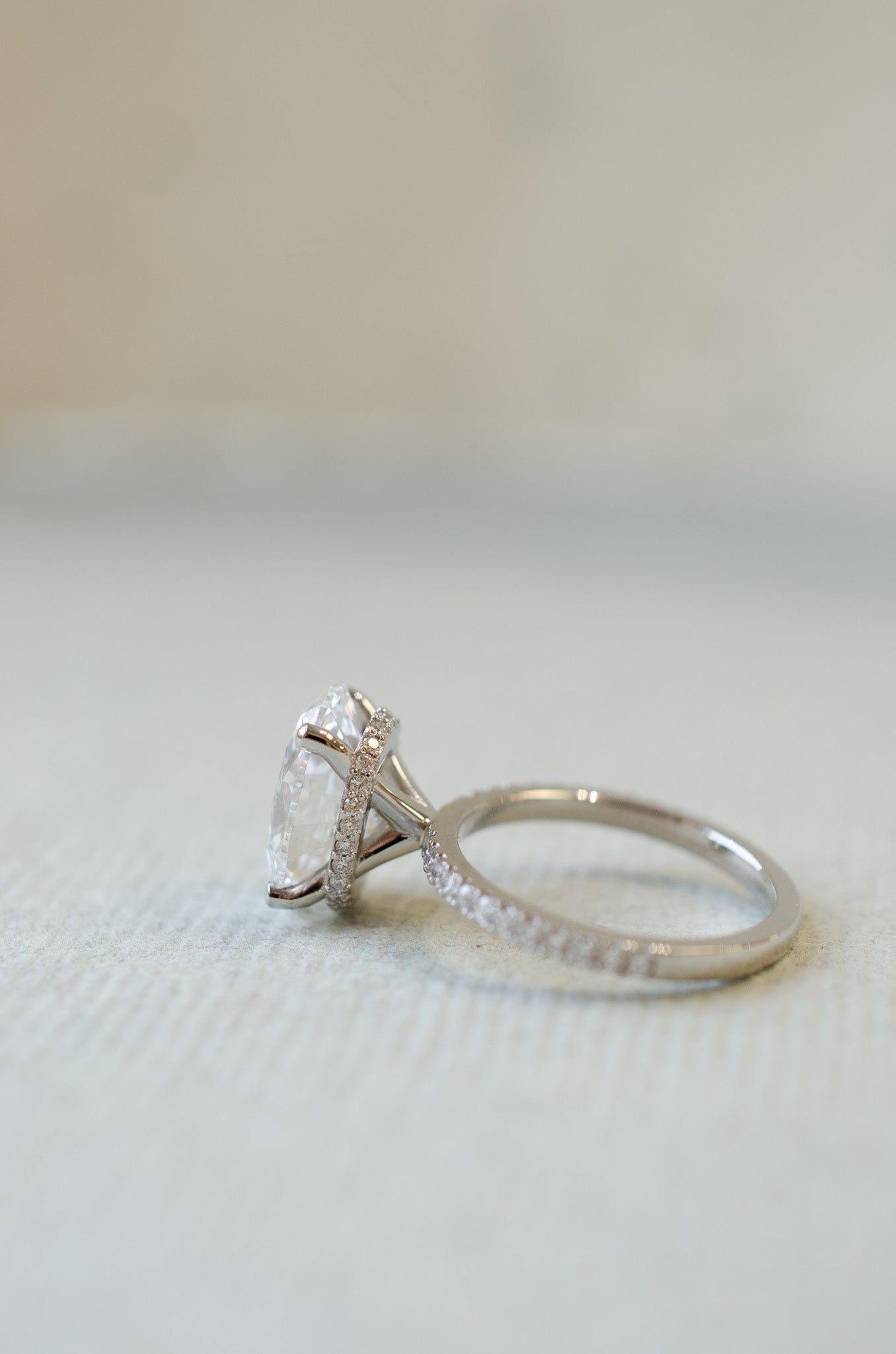 Oval Diamond Solitaire Ring With Diamond Collar Halo