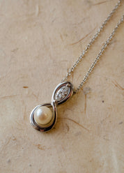 Infinity inspired pendant with pearl and diamond