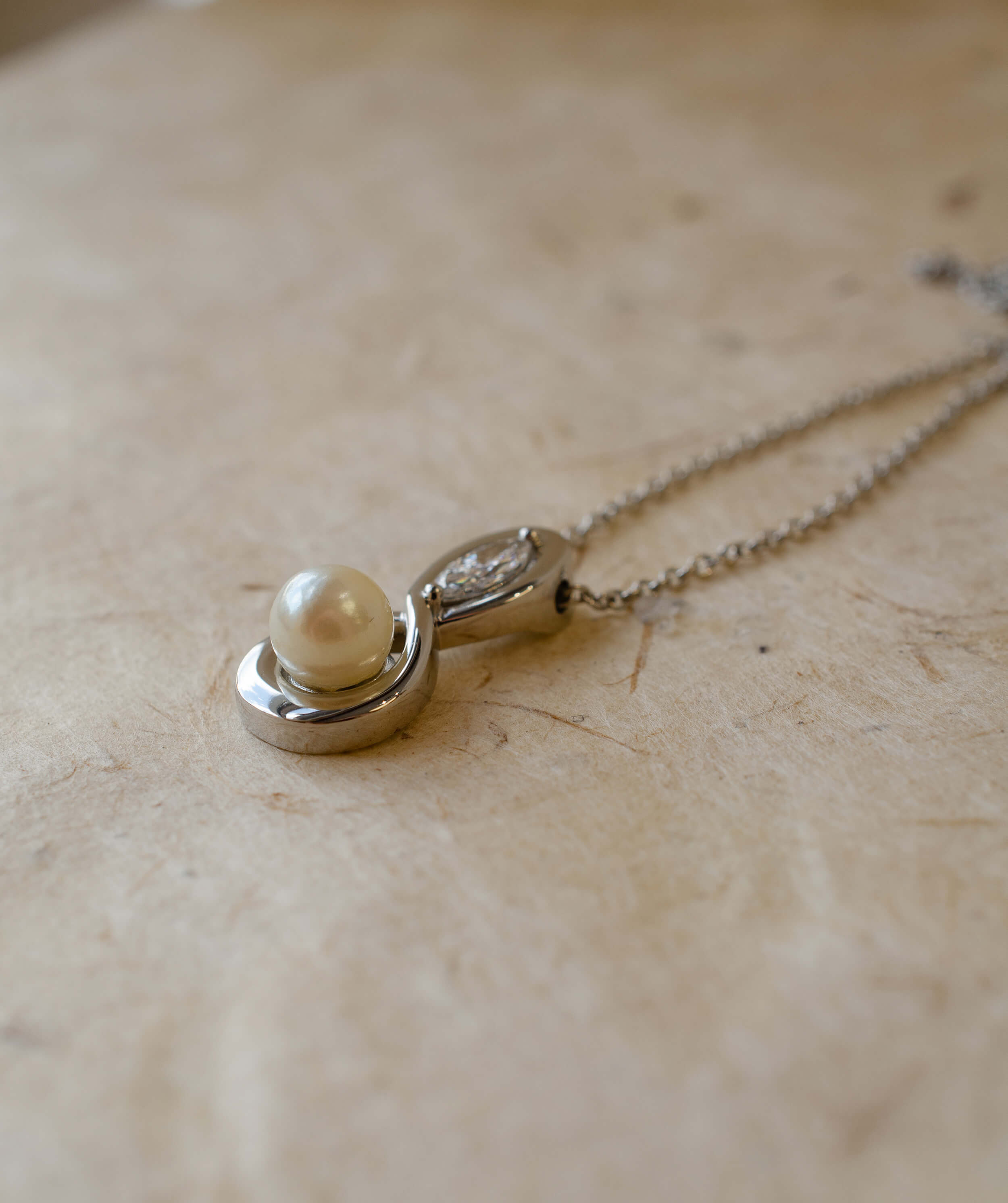 platinum diamond and pearl infinity pendant 