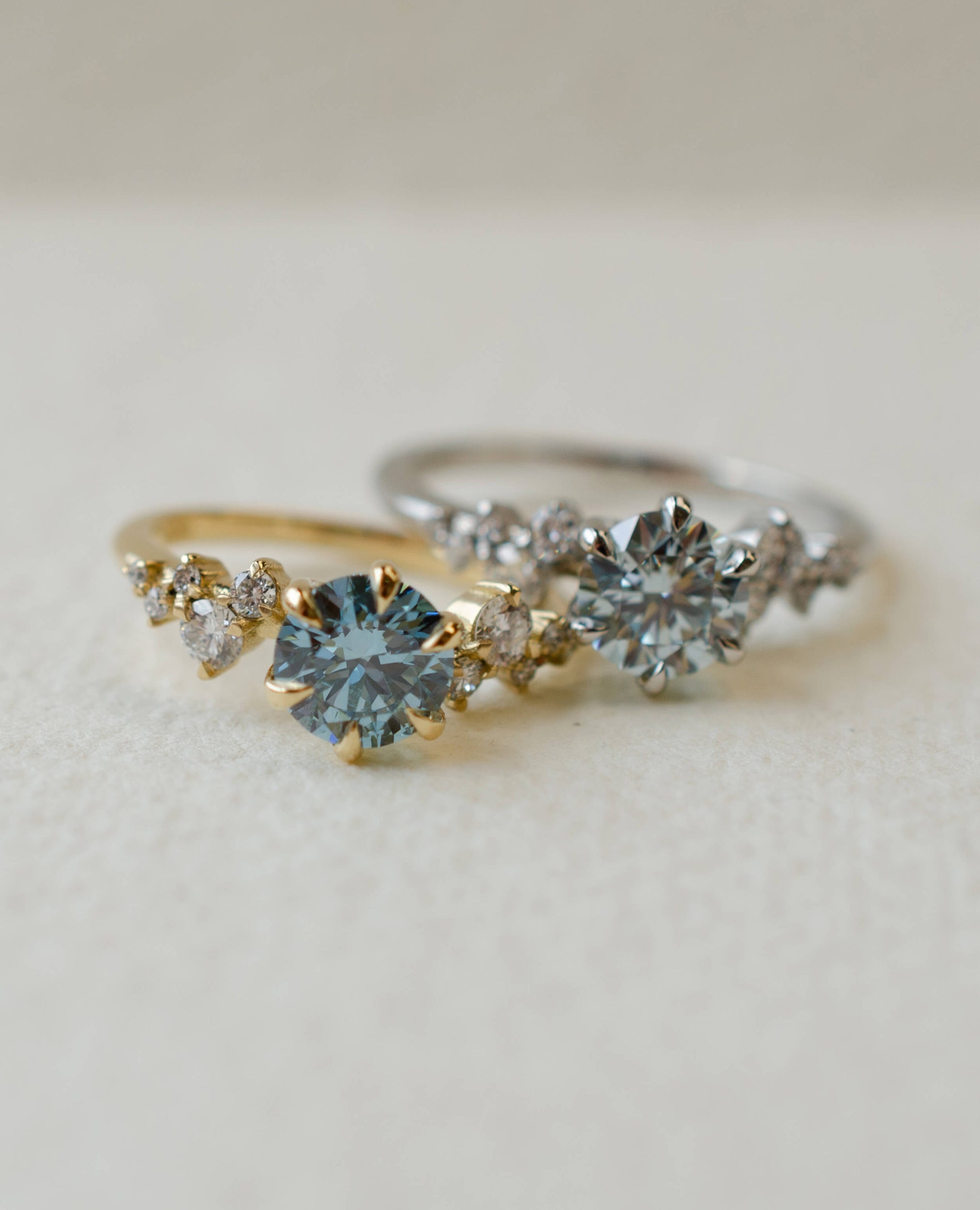 Blue diamond engagement ring with scatter diamond shoulders