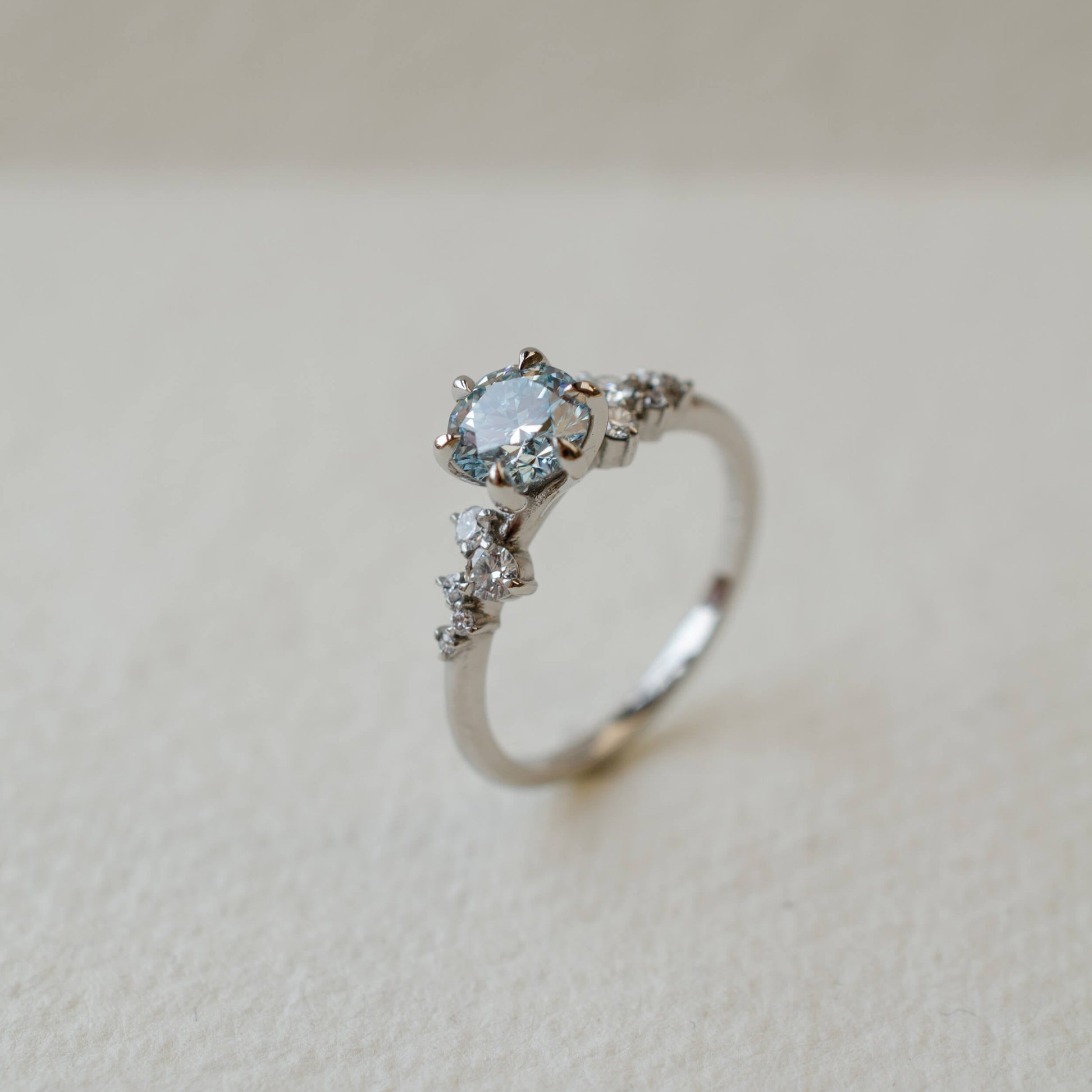Blue diamond and platinum engagement ring