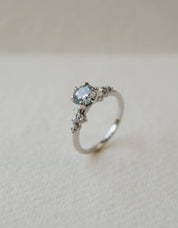 Blue diamond and platinum engagement ring