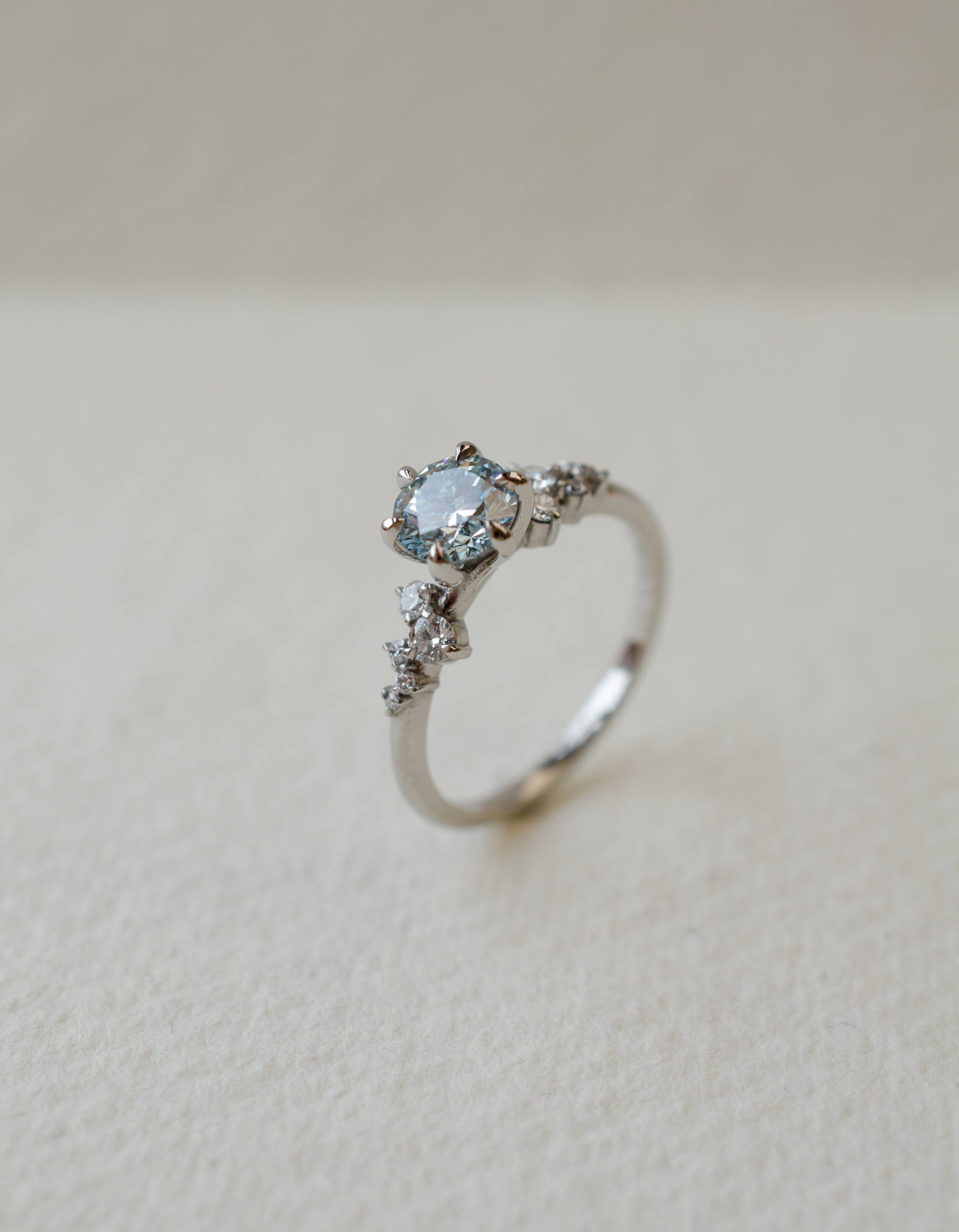 Blue diamond and platinum engagement ring