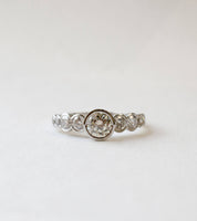 Platinum nine diamond rub-set engagement ring 