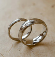 Platinum wedding band engraved with mountain landscape
