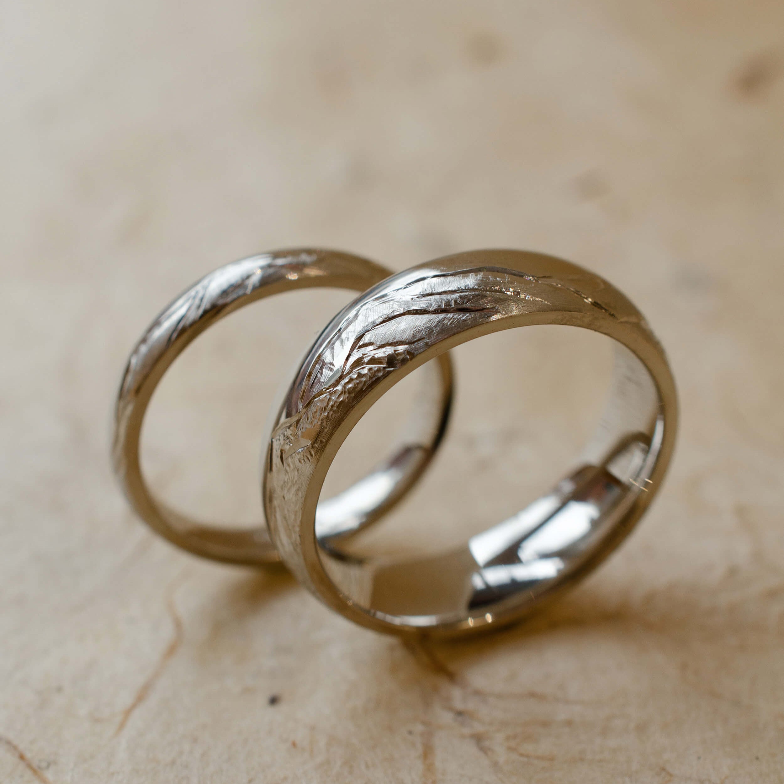 Platinum wedding band engraved with mountain landscape