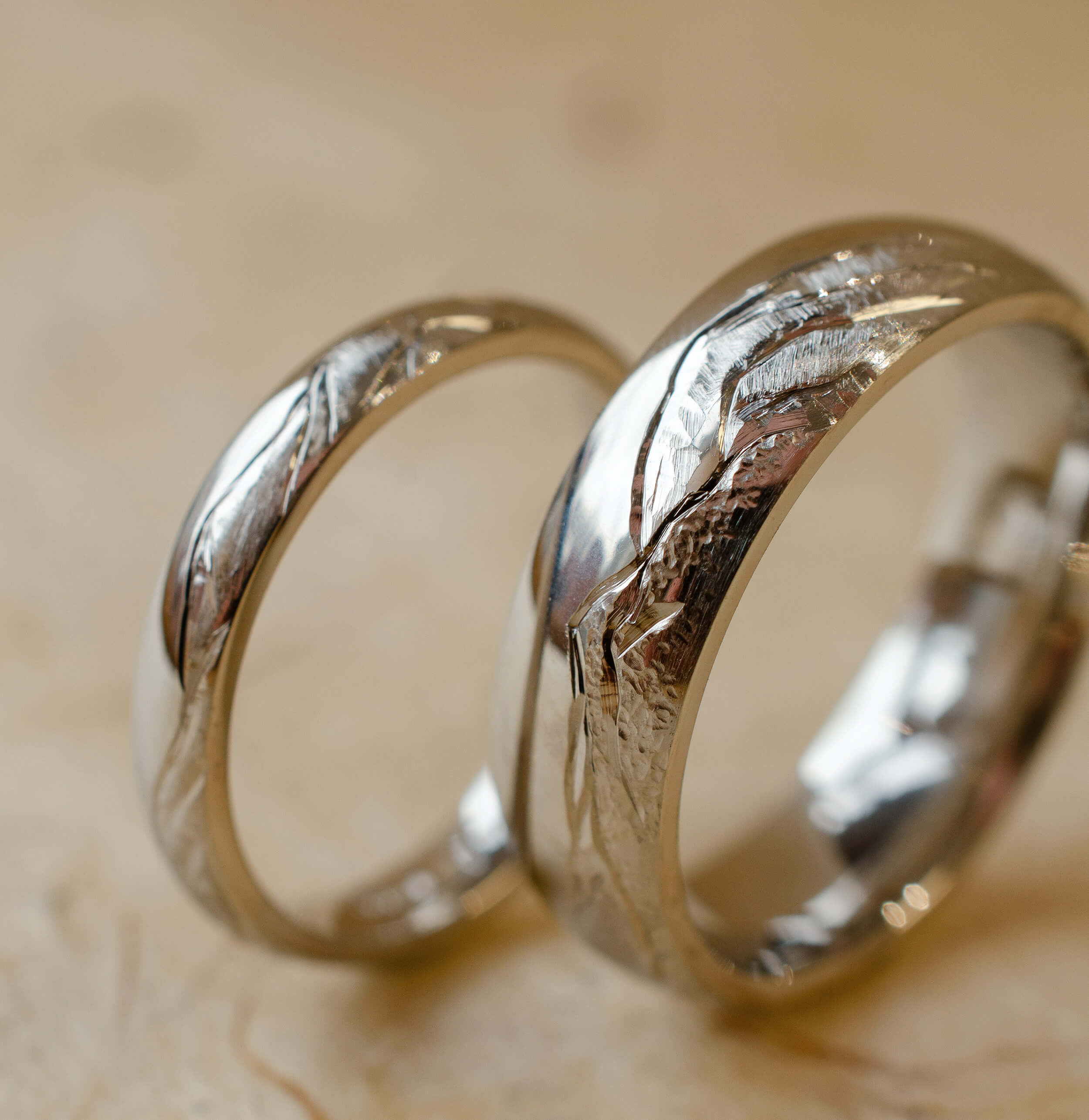 matching wedding bands with hand engraved mountainscape