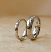 landscape engraved on his and hers platinum wedding rings