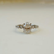 oval cut diamond engagement ring with diamond set shoulders