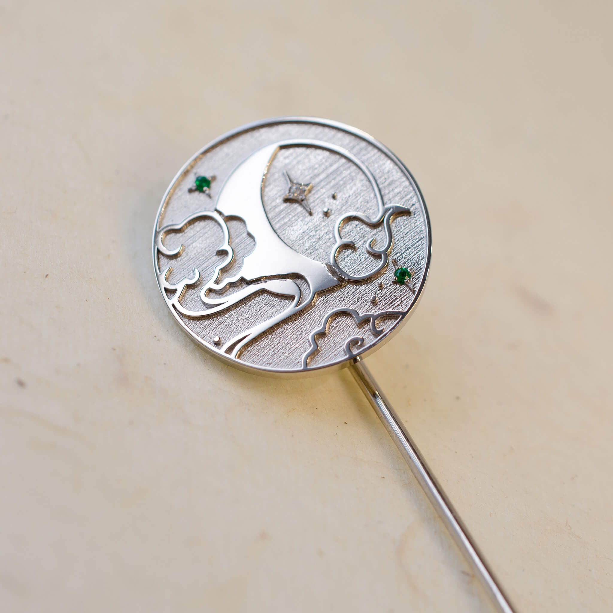 Platinum round celestial brooch