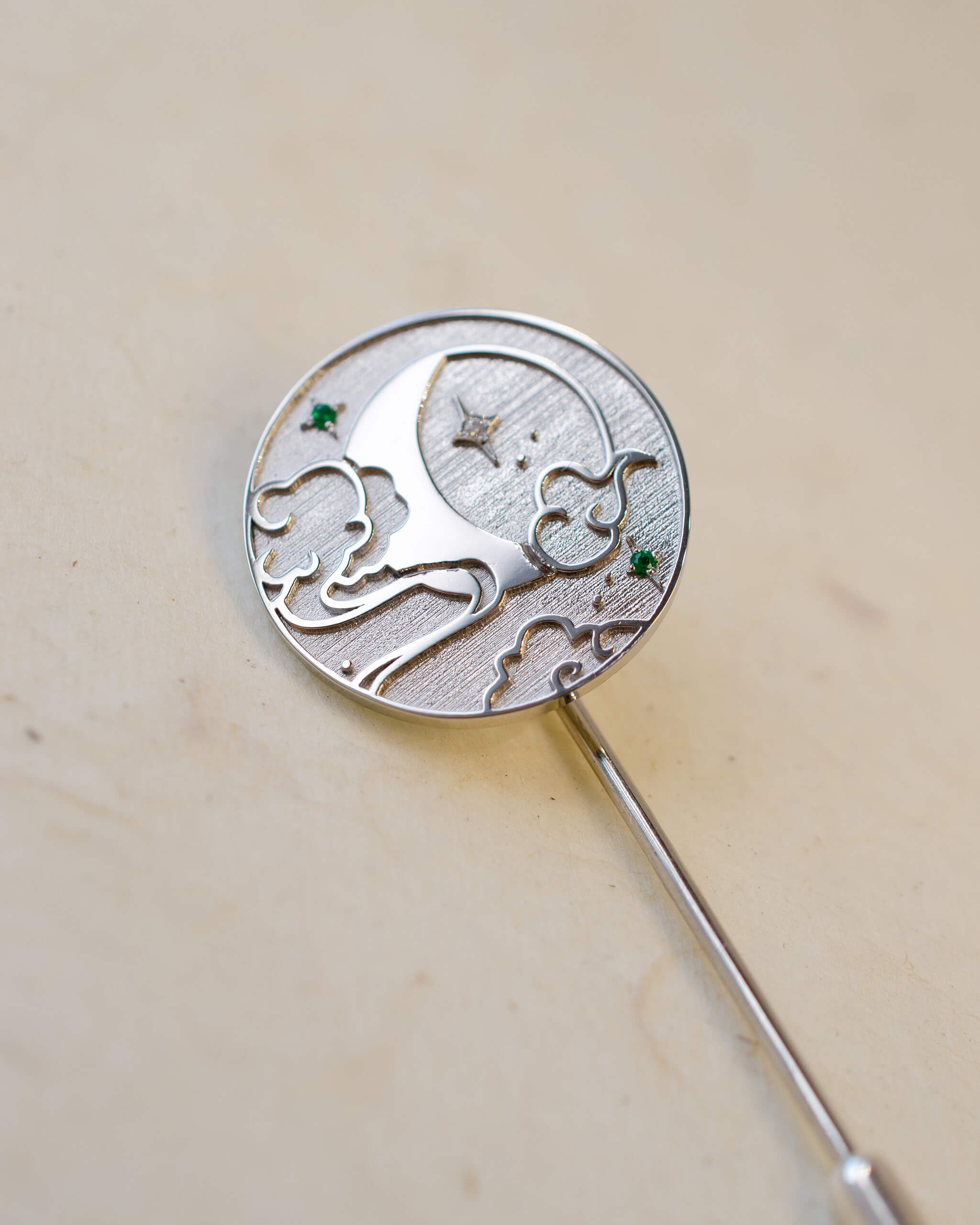 Platinum round celestial brooch