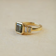 teal lab diamond engagement ring with baguette cut side stones