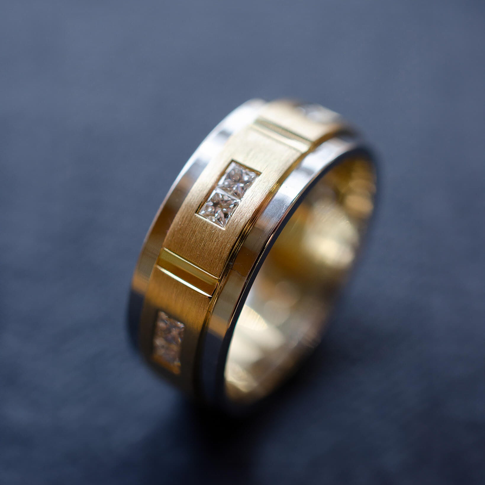 platinum and yellow gold gents wedding band with princess cut diamonds