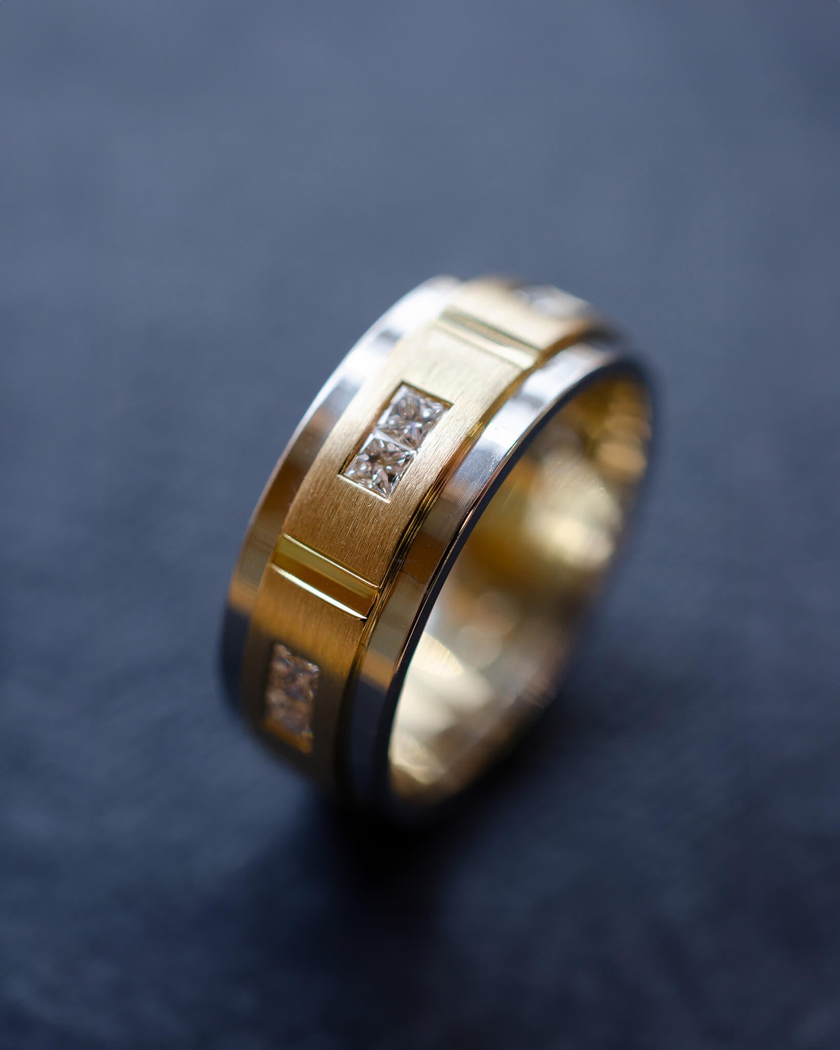 platinum and yellow gold gents wedding band with princess cut diamonds