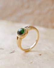 yellow gold alternative engagement ring with tourmaline cabochon