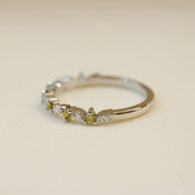 white marquise diamond and yellow round diamond wedding ring