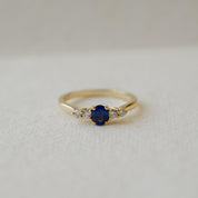 yellow gold five stone ring with sapphire and diamonds
