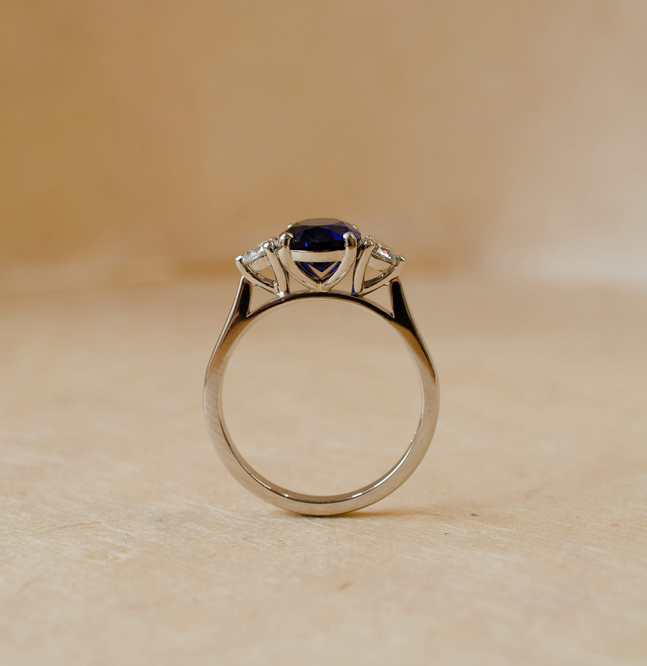 blue sapphire and diamond three stone ring 
