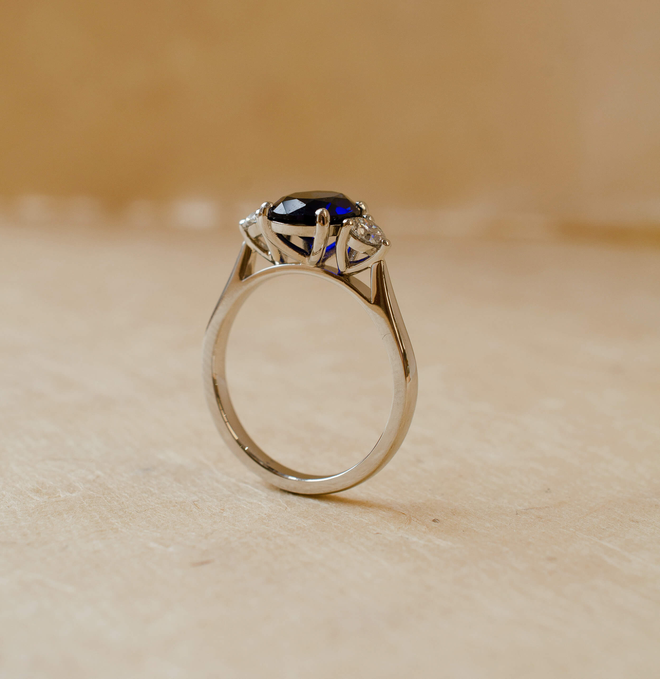 platinum diamond and blue sapphire three stone ring