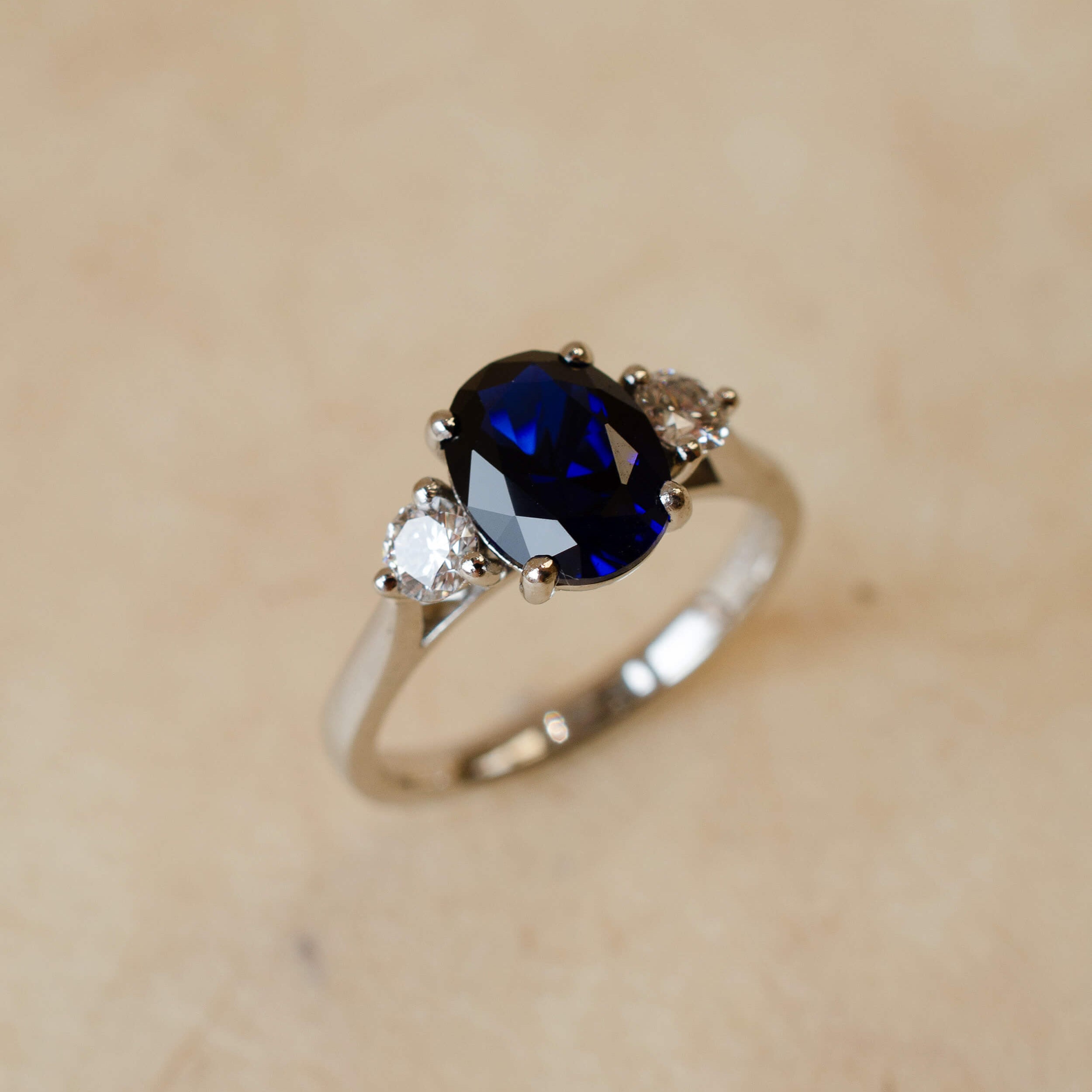 Platinum sapphire and diamond trilogy ring