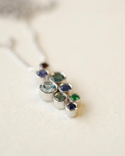 A platinum birthstone bubble necklace