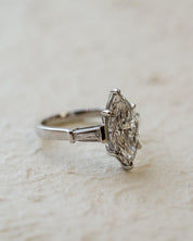 platinum diamond engagement ring with marquise and tapered baguettes
