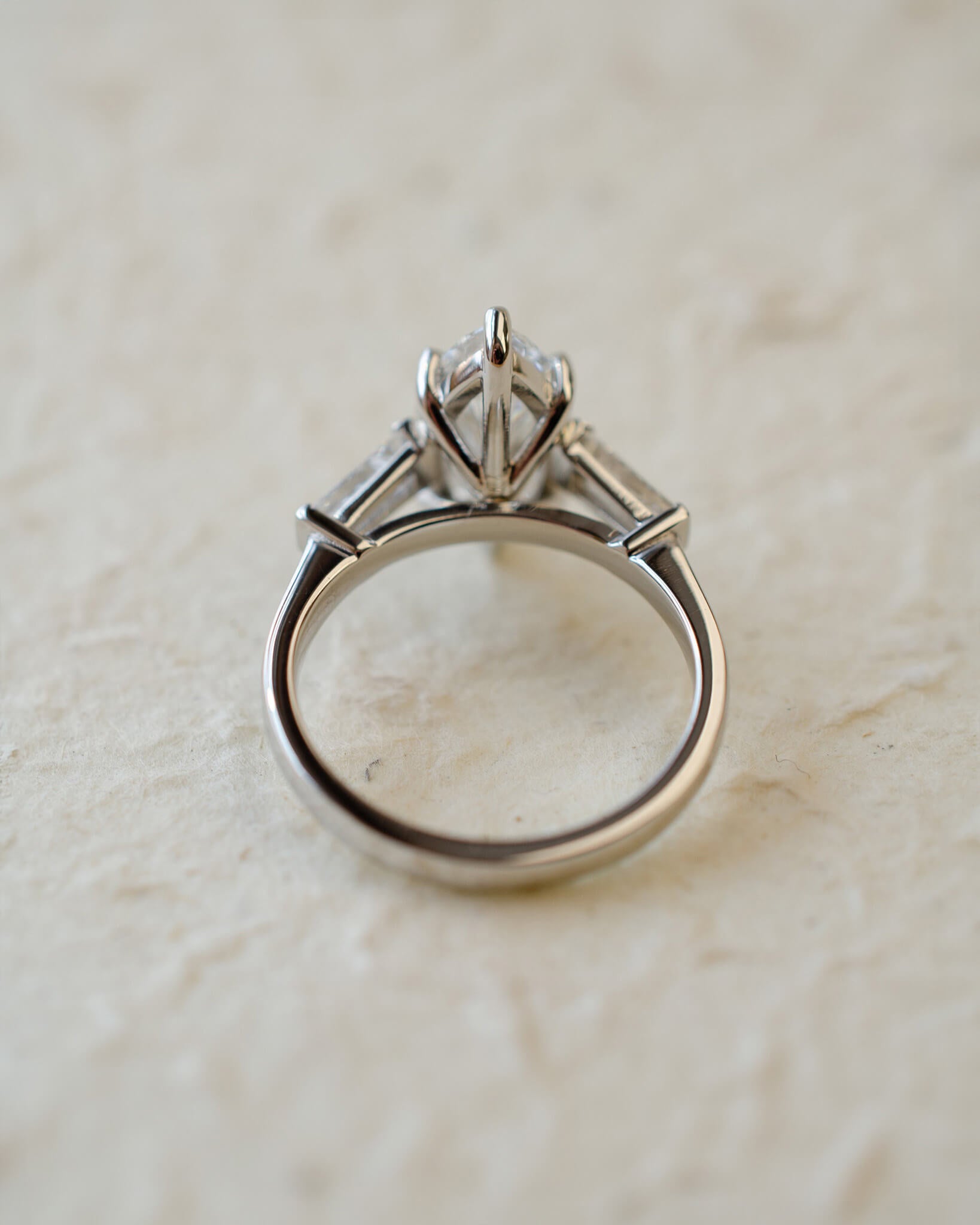 platinum diamond engagement ring with marquise and tapered baguettes