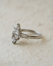 platinum diamond engagement ring with marquise and tapered baguettes