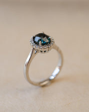 Teal sapphire and diamond cluster style ring