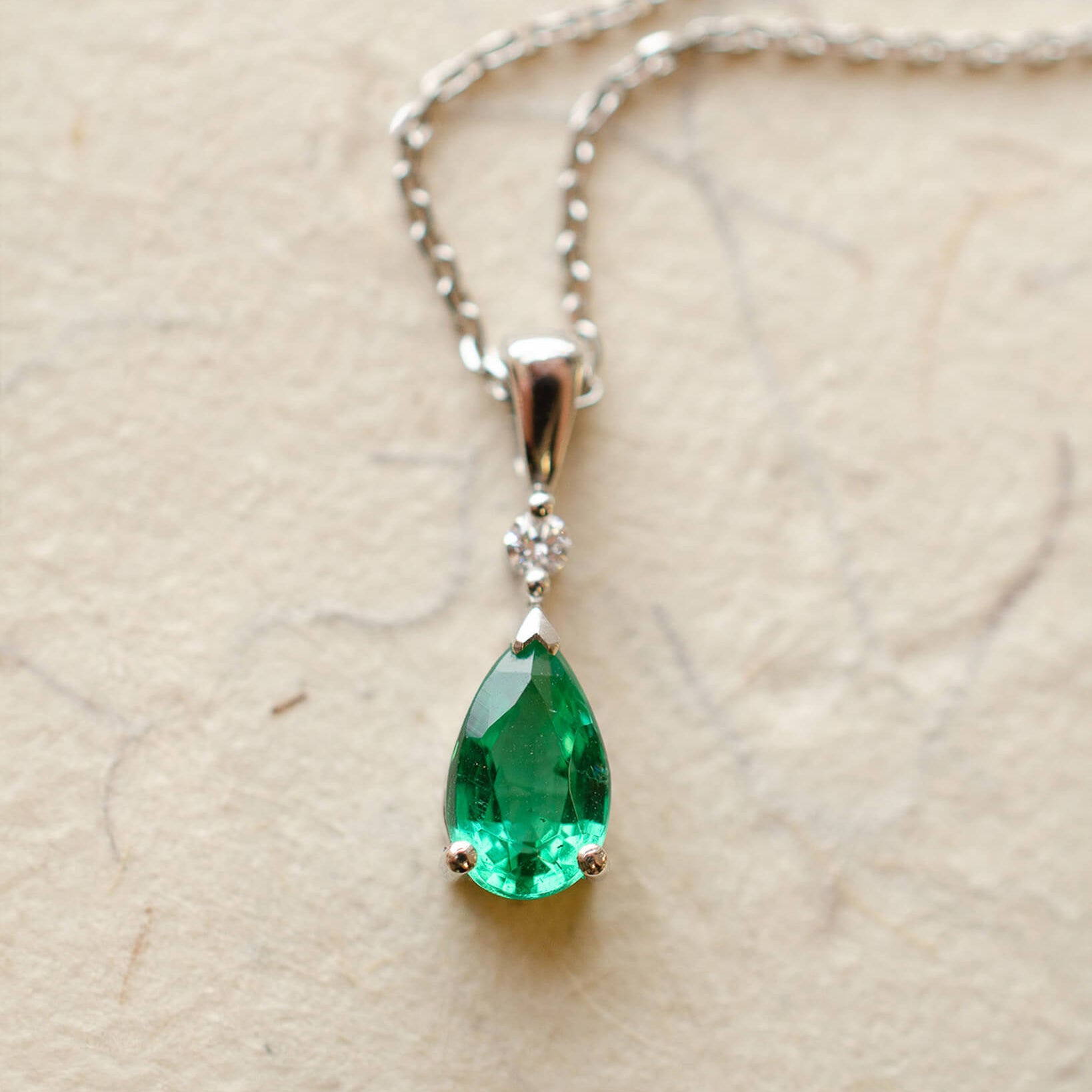 Platinum diamond and pear cut emerald necklace