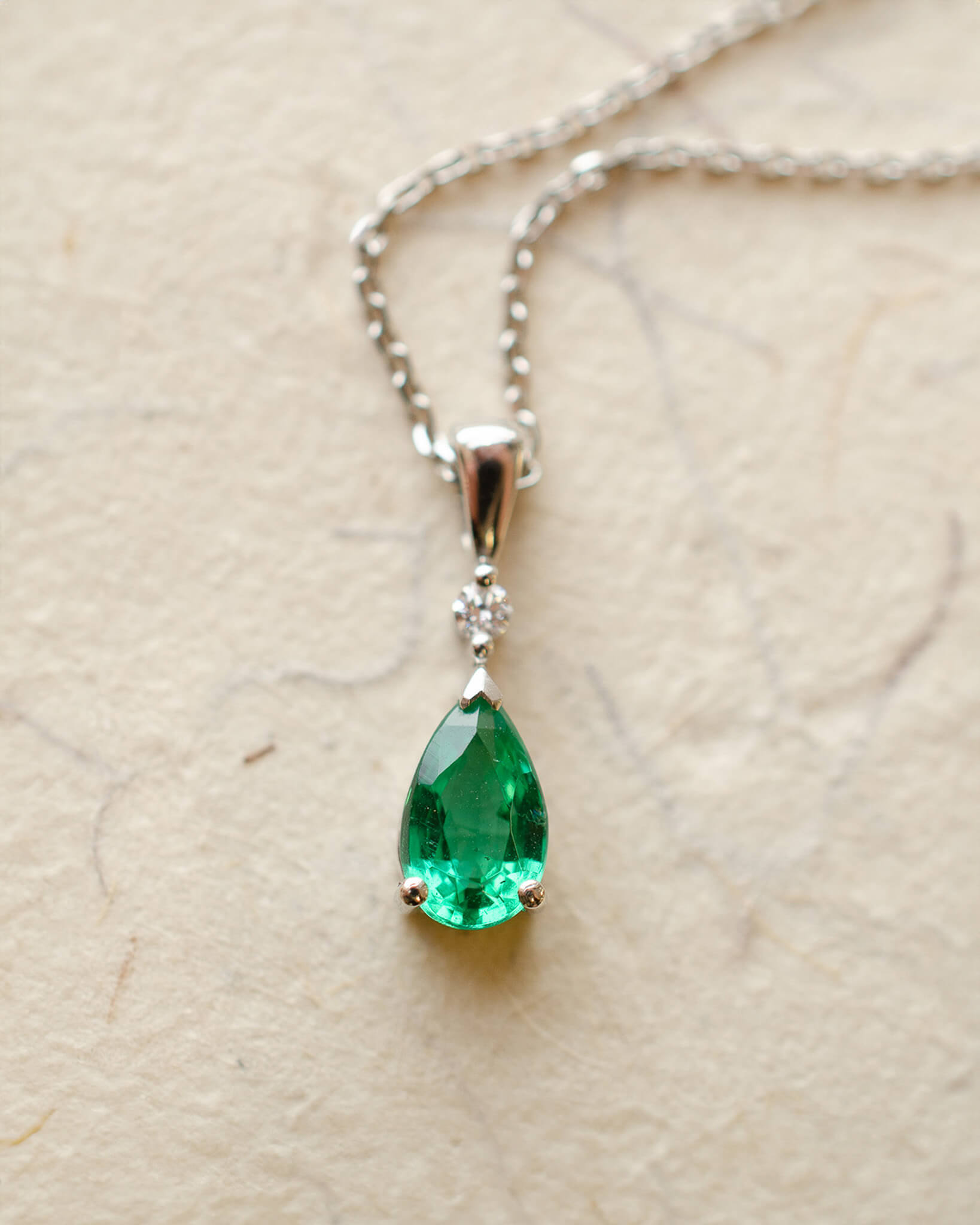 Platinum diamond and pear cut emerald necklace
