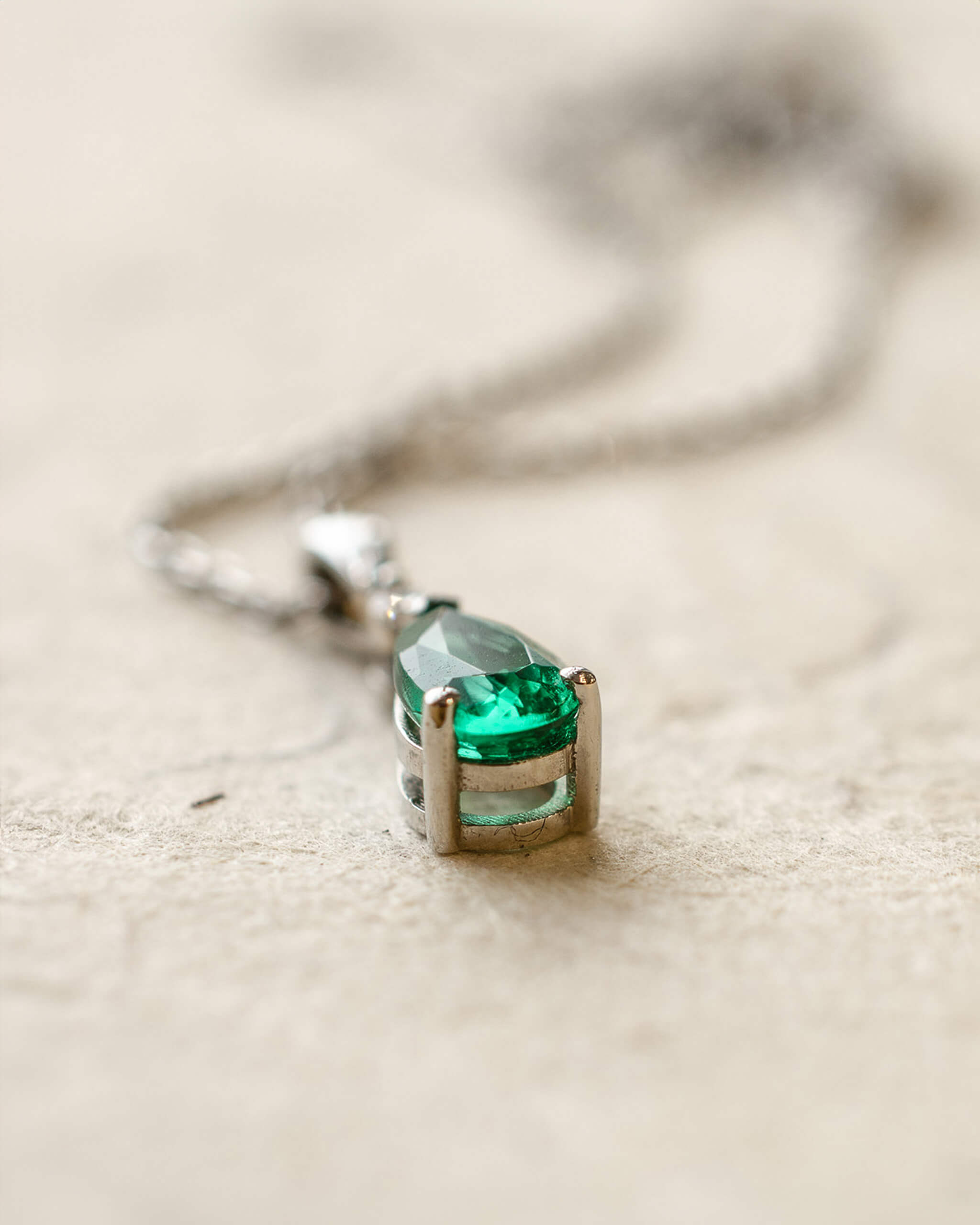 Platinum diamond and pear cut emerald necklace