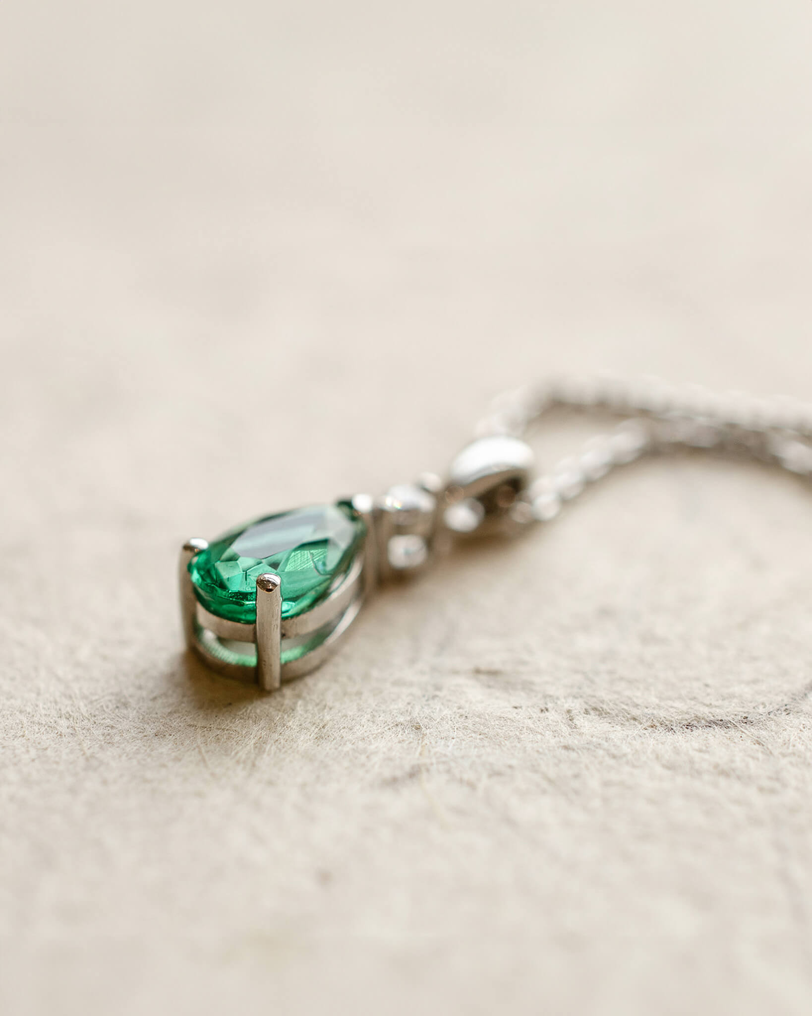 Platinum diamond and pear cut emerald necklace